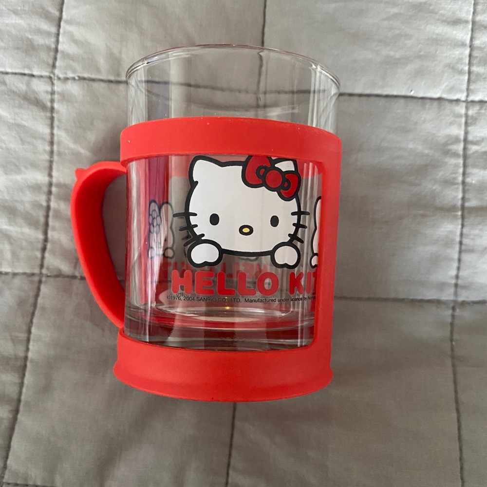 Hello, Kitty collectible glass cup with red plastic holder
